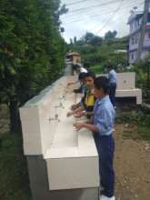 Students using drinking water station
