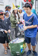Kids delivering food staples