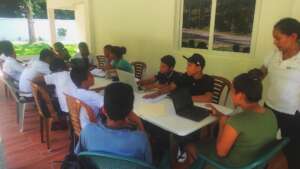 Students during tutoring program using new laptops