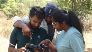 The team checking the drone footage