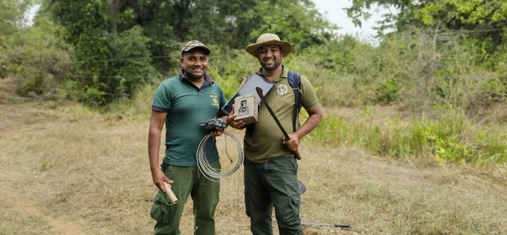 Team members preparing to set up the camera traps