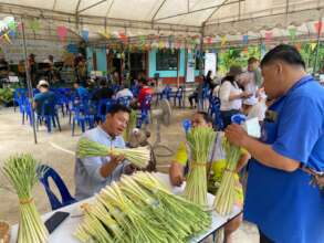 Village leader discussing alt crops with farmers