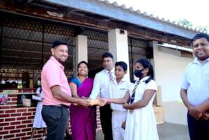 Donating school books to Udawalawe Maha Vidyalaya