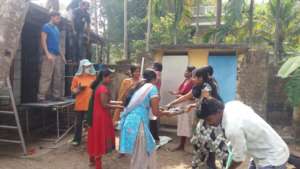 Everyone lending a hand on the toilet block