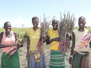 The women beneficiaries displaying joyful smiles