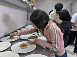 Our cooking workshop. Dalia helping to plate