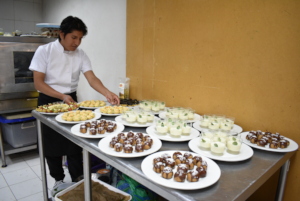 Ricard preparing snacks for an institutional event