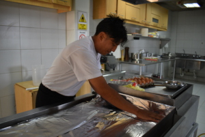 Ricardo preparing food for the children
