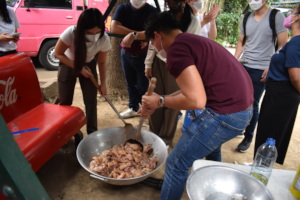 Volunteers helping each other to prepare meals