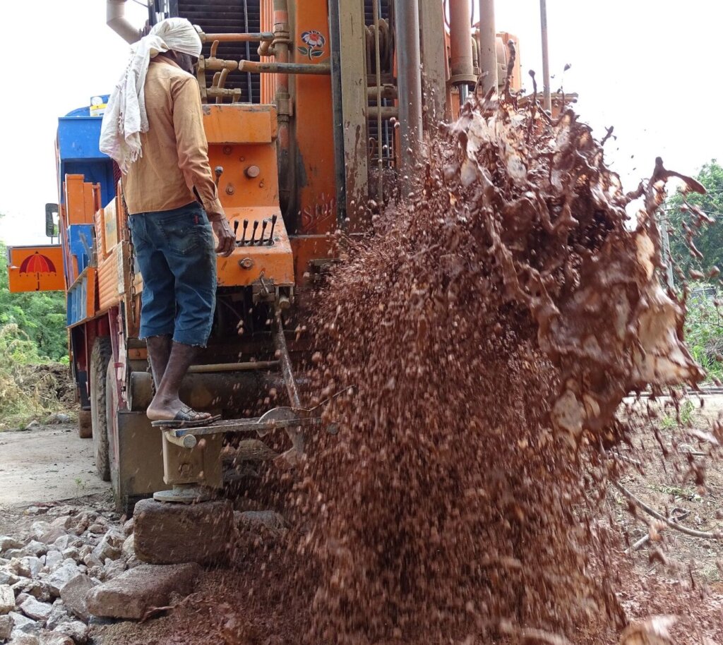 Truck mounted drilling rig in action