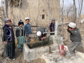 Children using a small well