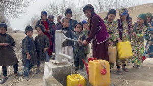 Community of children gathered at a well