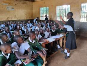Young girl leads peer talk in class