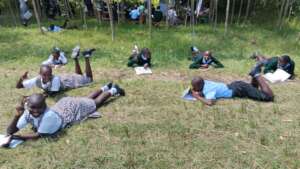 Girls writing anonymus feedback