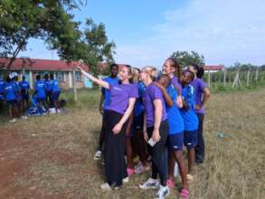 TK Volunteers taking selfies with Netball girls