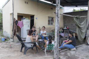 Promoters from La Madrid visiting a family