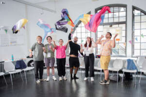 Participants playing with LGBTQI flags