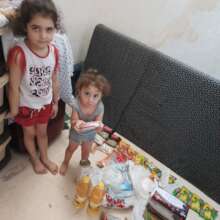 two sisters showing their food basket