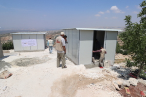 Construction work on latrine units in Syria