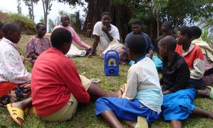 Children in Musanze District, Rwanda gather to listen to their L