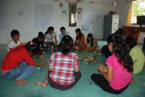 A Counselor working with a group of children.