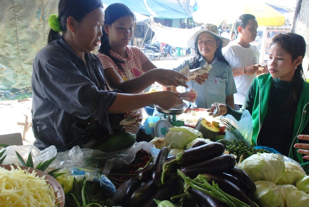 Mouey at her vegetable stand