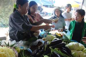 Mouey at her vegetable stand