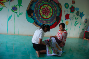 Srey Lys and her therapist at the shelter.
