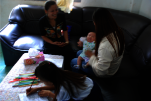 Two survivors of rape with a counselor.