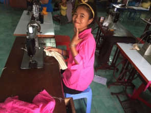 A young girl in the tailoring class