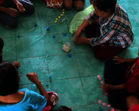 Small group of children doing art therapy