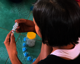 Doing crafts under guidance of teacher