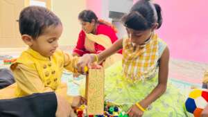 Sanjanna & Harris engaged in cooperative play