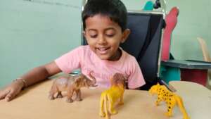 Chiranth enjoys playng with his toys