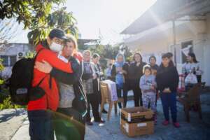 Earthquake survivor hugs Peace Winds staff member