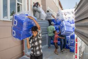 Bozhuyuk villagers help staff with coolers