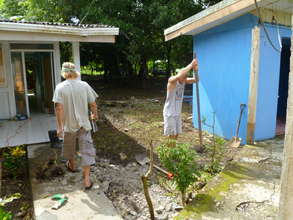 Community members helping to clean the school