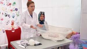 Staff providing awareness session on baby bath