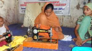 Girl sewing children cloths
