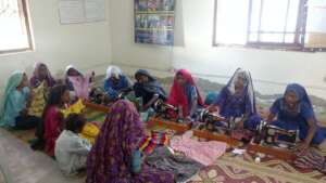women during class of sewing
