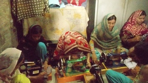 Women learning the sewing in sewing center