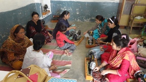 Young women learnning sewing skills