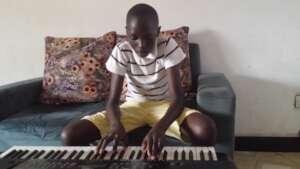 Asher playing keyboard