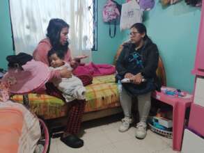 Our educator making a home visit to a mother