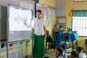 Children engaged in learning Khmer literacy