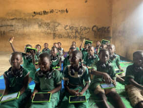Children learning on tablets