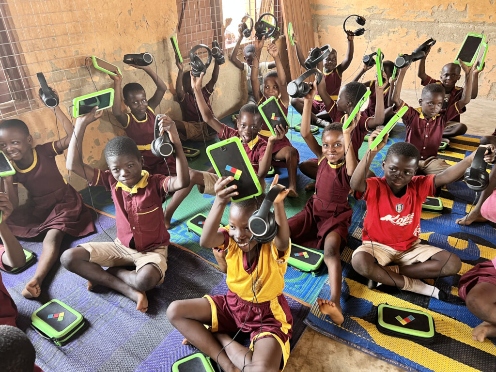 Children learning over tablets