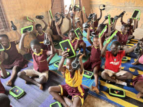 Children learning over tablets