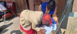 Guardian signing for last flour distribution