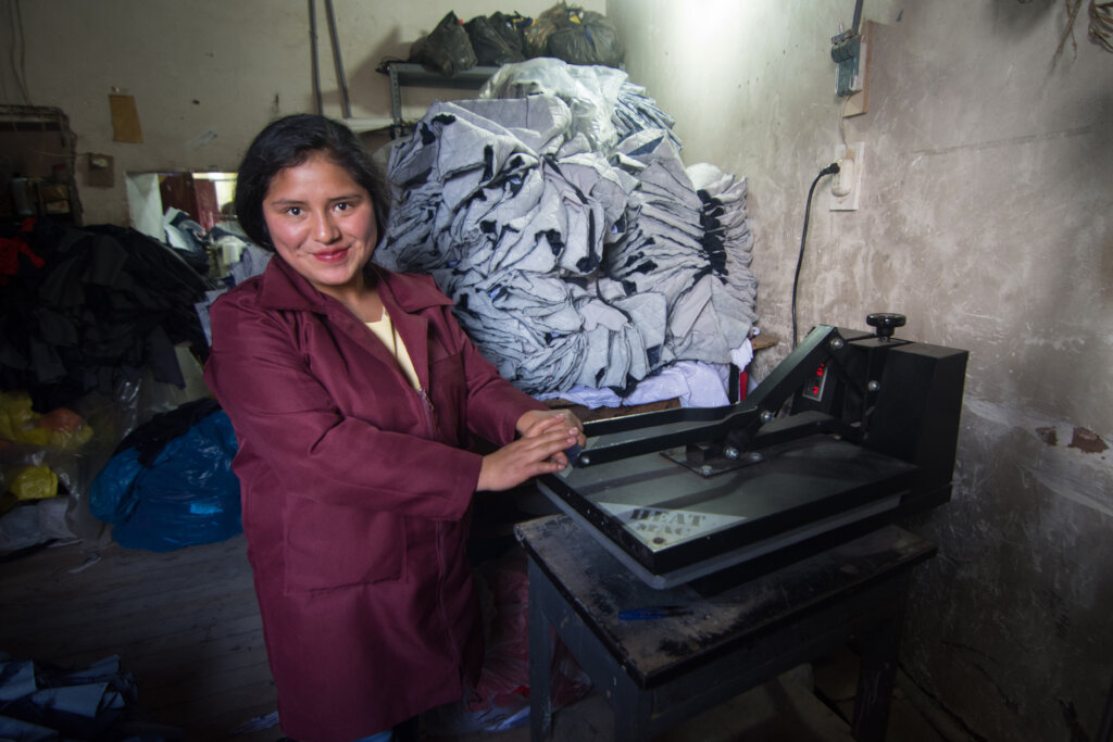A clothing production student at the workshop